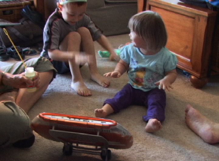 Watch and listen to other children at play:  KW plays bubbles